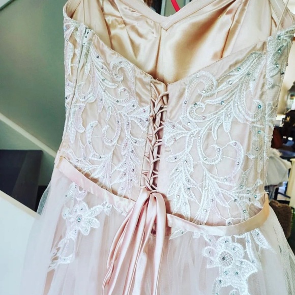 Beautiful sheer white with hints of pink prom dress never worn. Size 4 - Picture 8 of 15